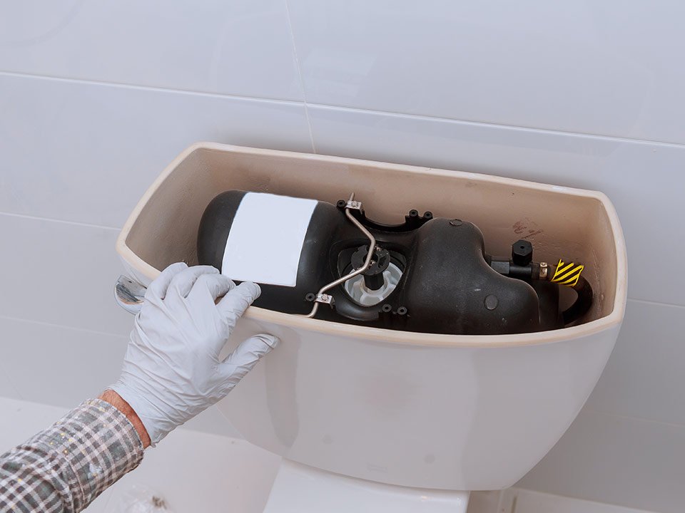 Flush Tank 105 plumber repairing toilet tank in bathroom plumbing 2023 11 27 05 27 50 utc
