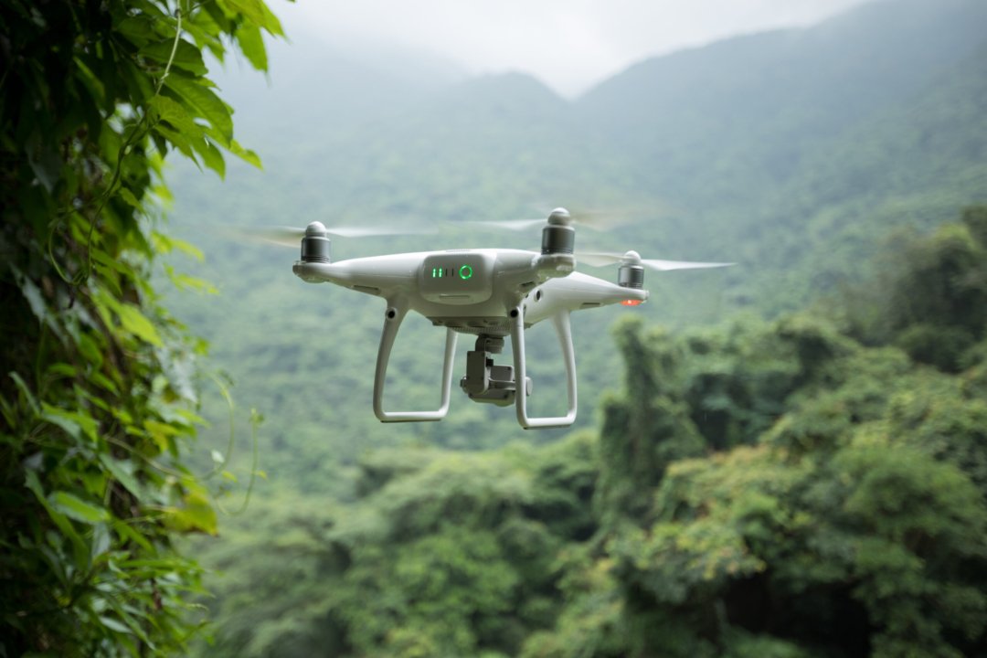 white drone with camera flying over tropical fores 2024 12 06 06 45 38 utc scaled uai